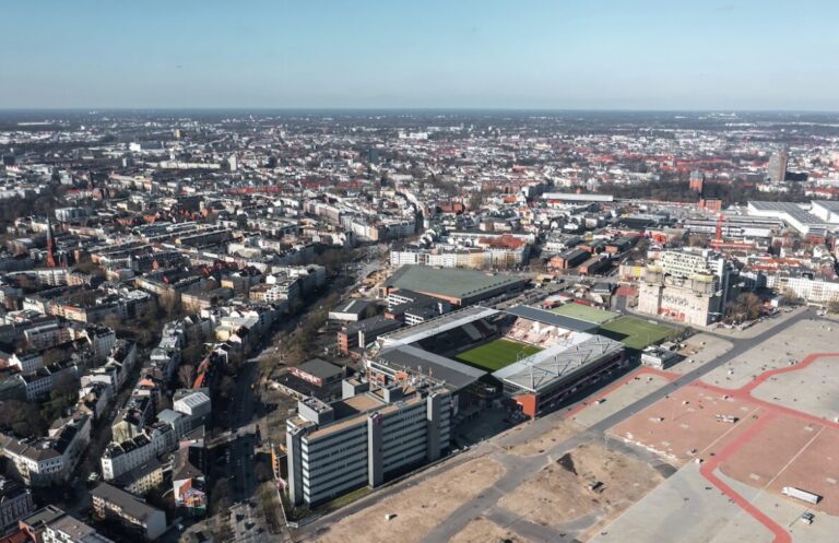 Vista aérea de una ciudad Alemana y un estadio de fútbol